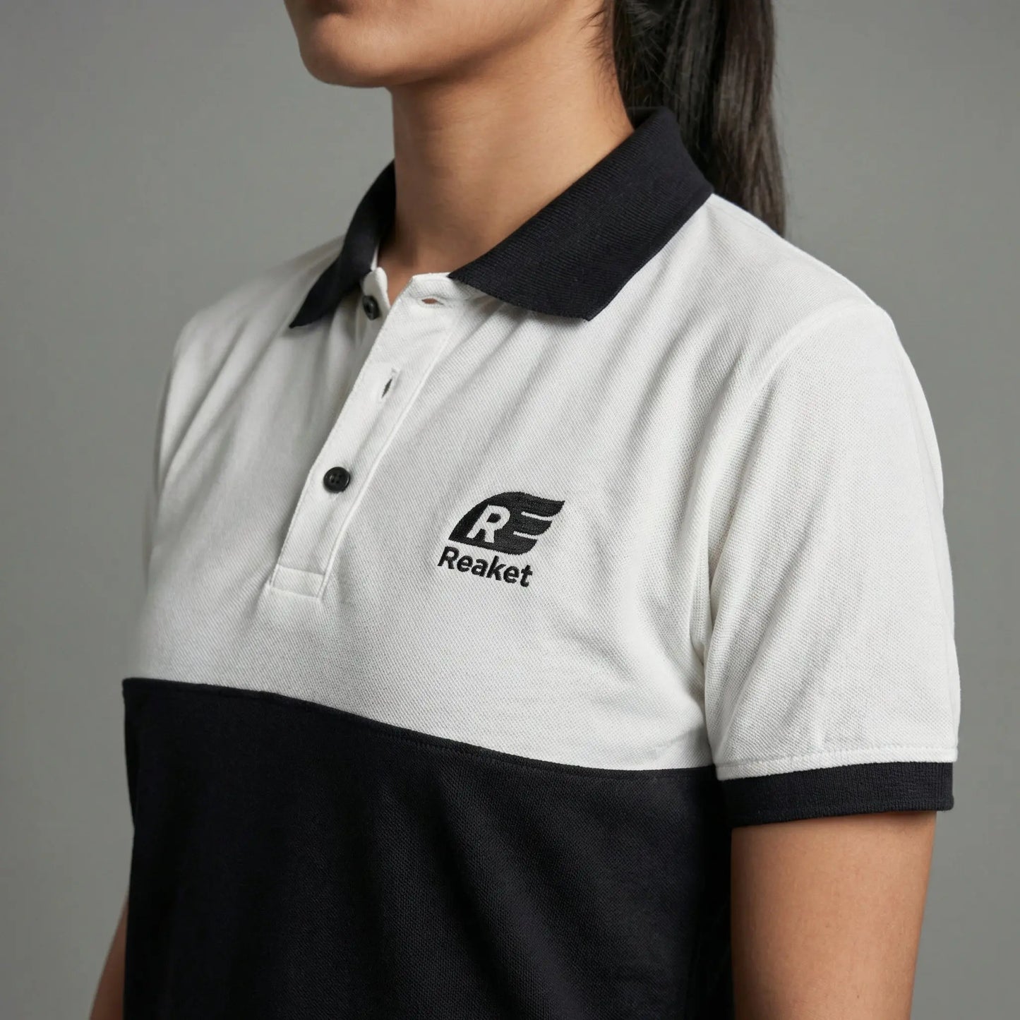 Polo Reaket win win Unisexe Reaket, une marque de vêtements de sport